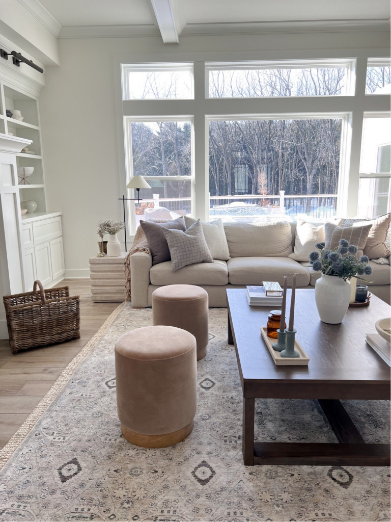 Fashion Winds— Ottomans in front of fireplace